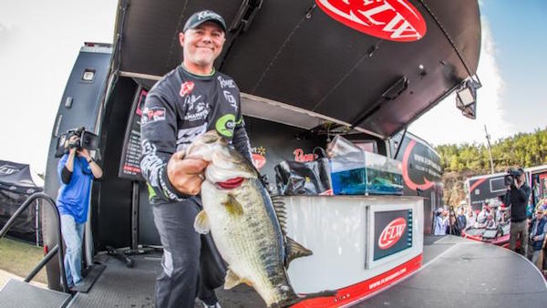 Dave Lefebre hoists one of the bass that launched him to the win on the final day of the Walmart FLW Tour at Smith Lake.